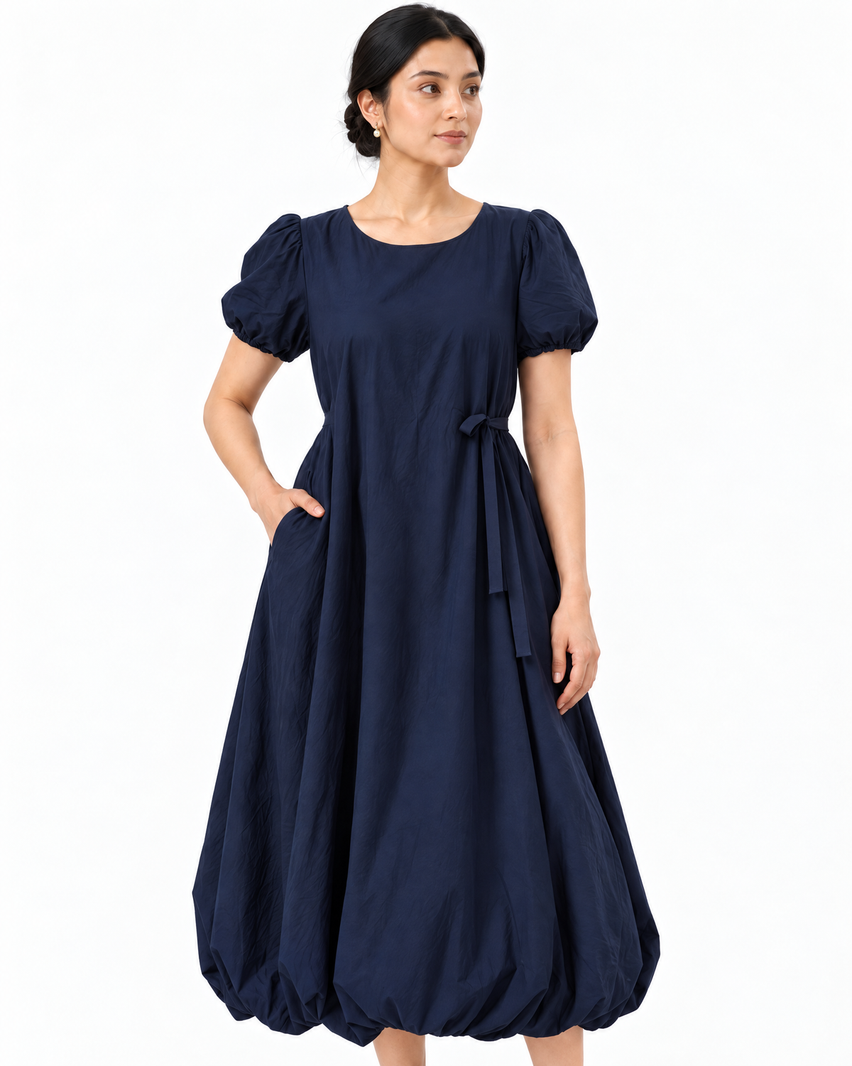 Closer styling view of The Lamorah navy balloon-hem dress with side pocket and removable narrow sash.