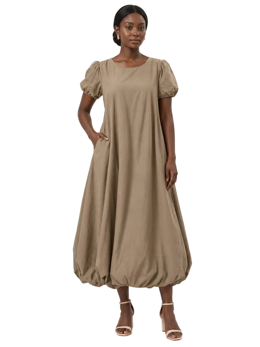 Full-length front view of The Lamorah taupe puff-sleeve balloon-hem dress worn without its removable sash.