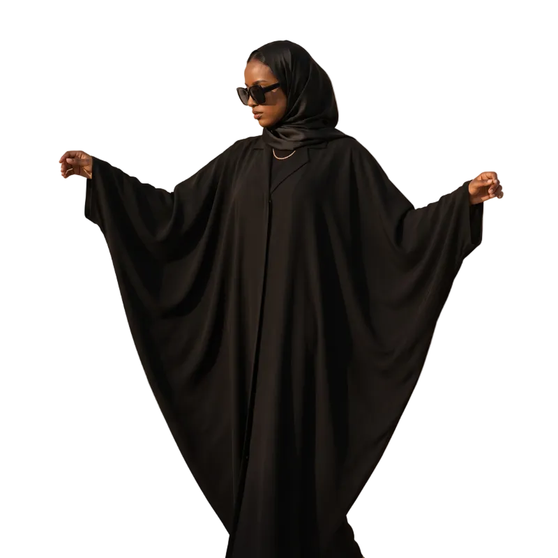 Black wide-sleeve abaya with flowing batwing sleeves, worn with a black shayla