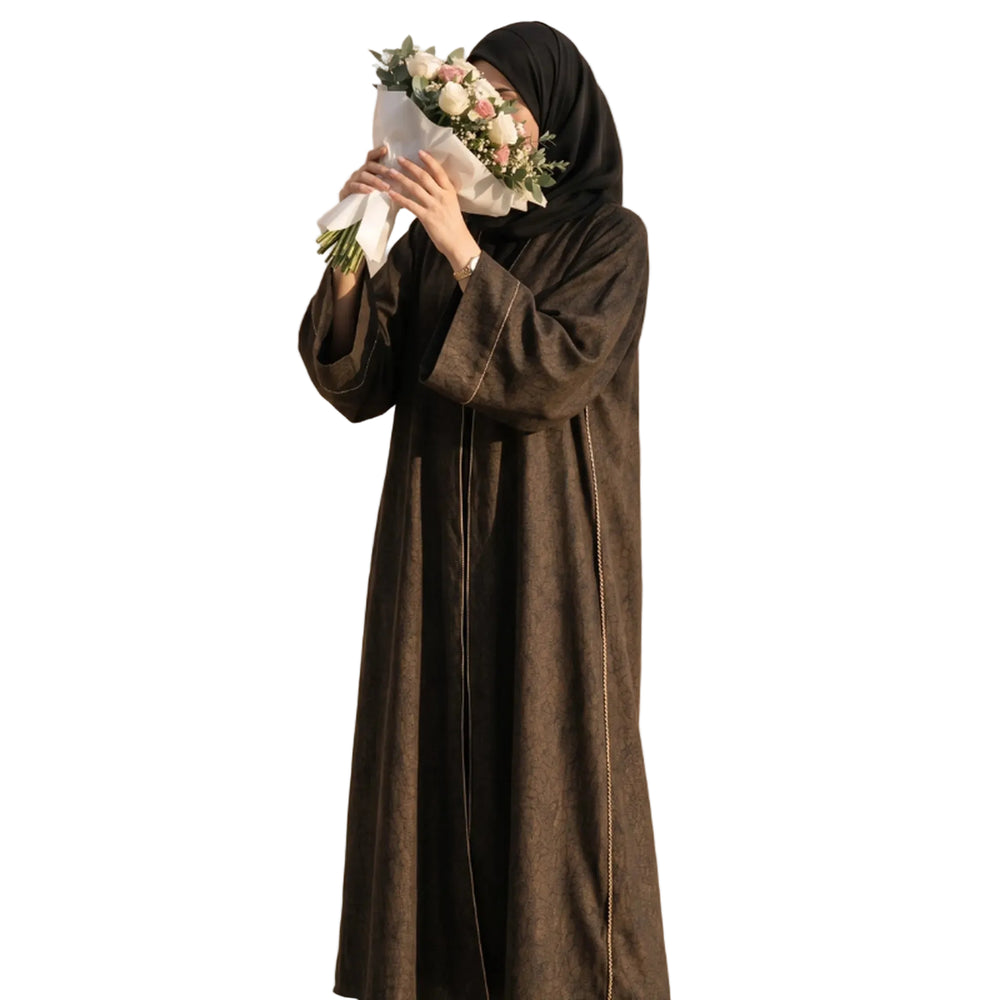 Bronze abaya with fine gold cord trim down both front edges, worn standing