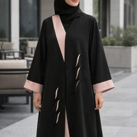 The black and blush beaded abaya worn with a black shella, from The Lamorah Dubai