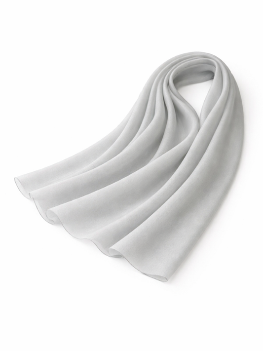 White chiffon shella folded on a white background, from The Lamorah Dubai
