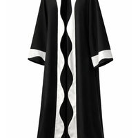 Black and white patterned coat on a white background |THE LAMORAH
