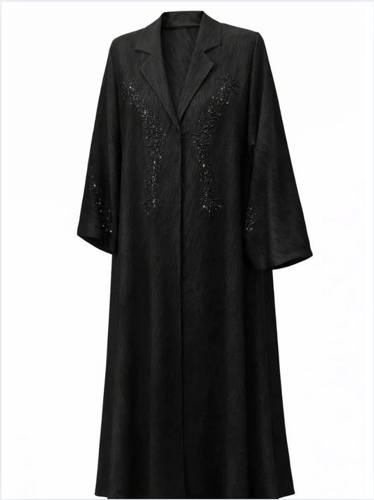 Black coat with decorative elements on a white background |THE LAMORAH
