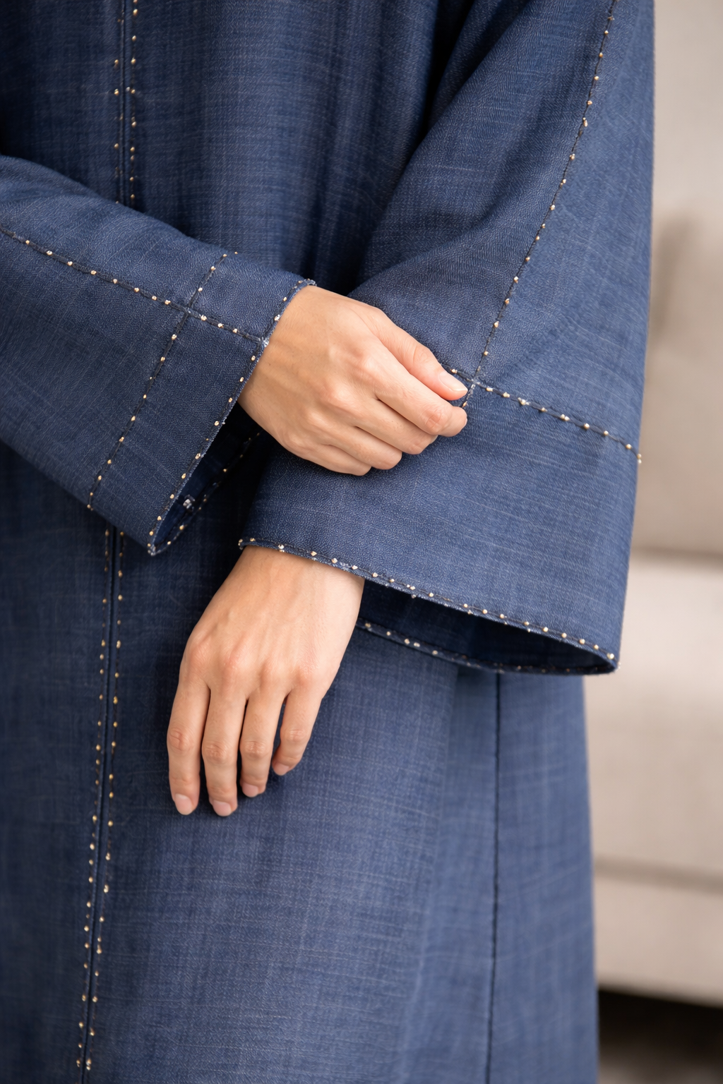 Close-up of a blue garment with a blurred background| THE LAMORAH