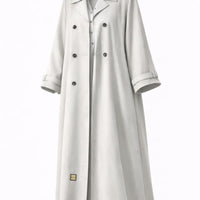 Off-white trench-style abaya with dark double-breasted buttons and a notched lapel, cut to measure by The Lamorah Dubai