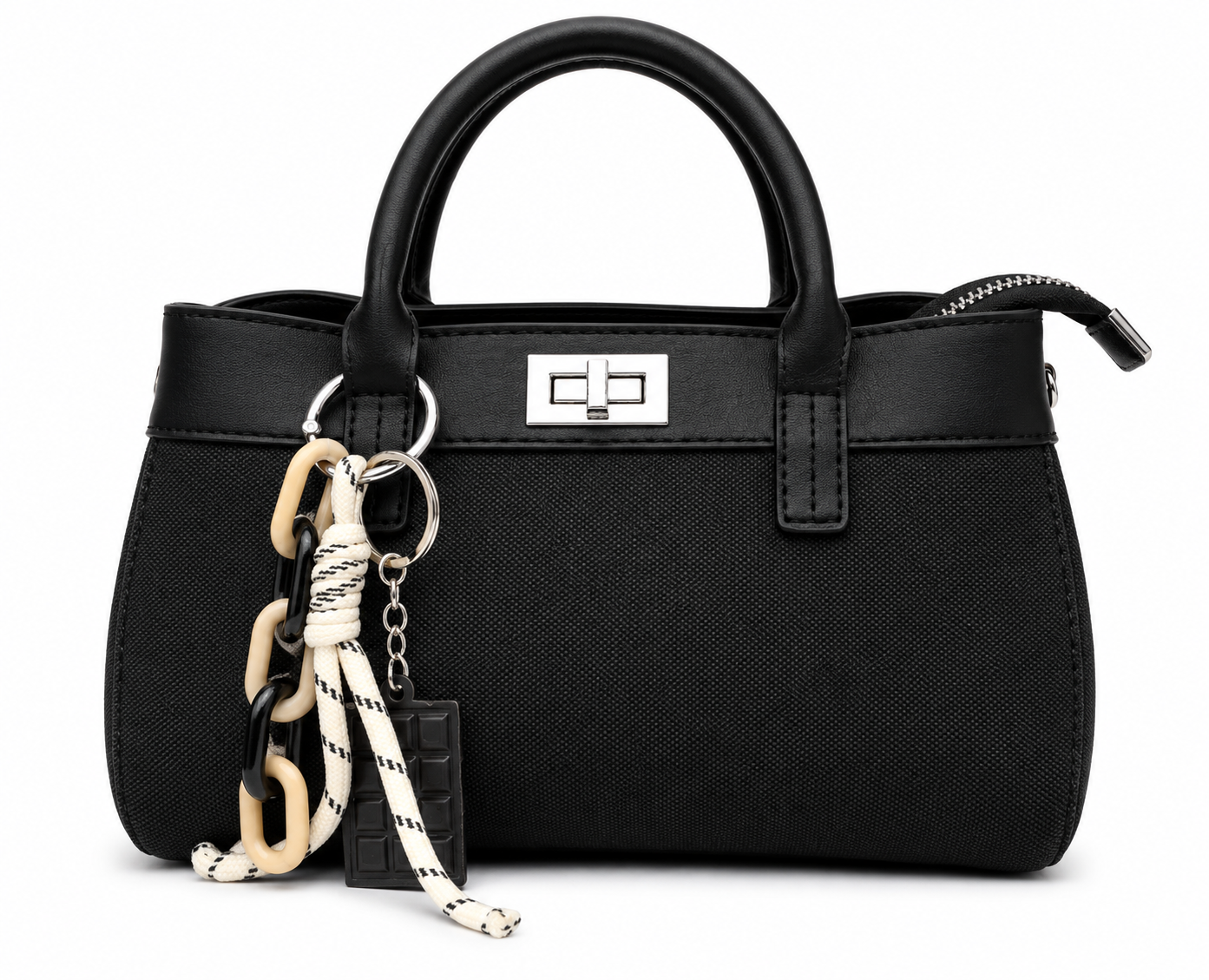 Black woven canvas mini tote with black leather trim, silver twist lock and a chocolate bar charm, from The Lamorah Dubai