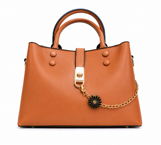 Caramel smooth leather shoulder tote with a gold chain and black daisy charm across the front, from The Lamorah Dubai