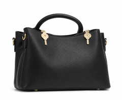 Black pebbled leather satchel with winged sides, two rolled top handles and twin gold sunburst zip pulls, from The Lamorah Dubai