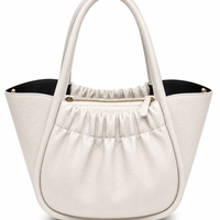 Chalk white pebbled leather bucket tote with a gathered front panel, gold zip and black lining, from The Lamorah Dubai