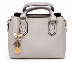 Dove grey pebbled winged tote with gold studs and a gold bow charm with amber and honey drops, from The Lamorah Dubai