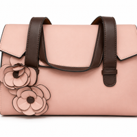 Blush pink flap bag with dark brown strap handles and two applied leather flowers on the front, from The Lamorah Dubai