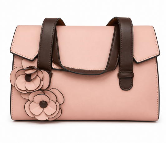 Blush pink flap bag with dark brown strap handles and two applied leather flowers on the front, from The Lamorah Dubai