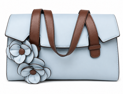 Powder blue flap bag with chestnut brown strap handles and two applied leather flowers on the front, from The Lamorah Dubai