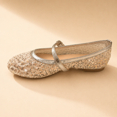 Champagne sequin Mary Jane flat with a gold leather strap across the foot, from The Lamorah Dubai